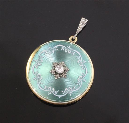 An Edwardian 18ct gold, guilloche enamel and diamond set circular pendant locket, pendant 26mm.